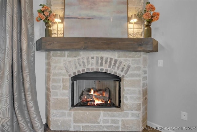 30130 S Maxine Ave, Inola, OK 74036 - detailed view of a lit fireplace and baseboards