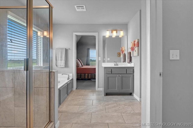 30130 S Maxine Ave, Inola, OK 74036 - bathroom with vanity, a garden tub, ensuite bath, and a stall shower