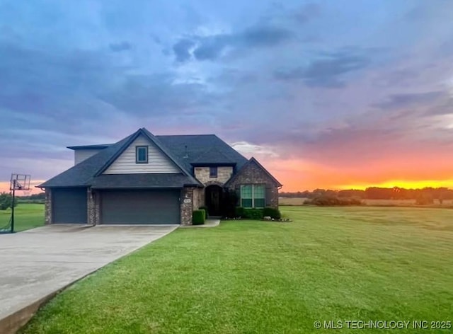 30130 S Maxine Ave, Inola, OK 74036 - view of front of home featuring a lawn, concrete driveway, and a garage