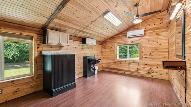 20512 E 430th Rd, Claremore, OK 74017 - unfurnished living room featuring vaulted ceiling, a wall mounted AC, wood finished floors, wooden walls, and wood ceiling