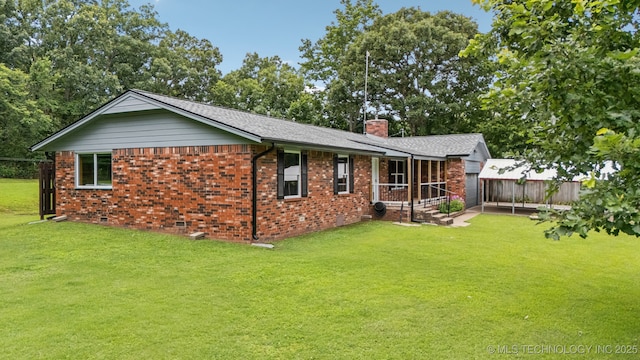 20512 E 430th Rd, Claremore, OK 74017 - rear view of house featuring brick siding, a chimney, and an attached garage