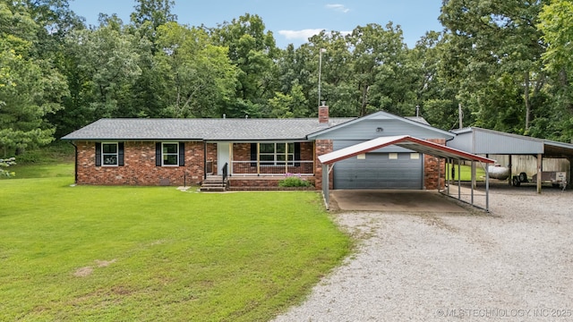 20512 E 430th Rd, Claremore, OK 74017 - single story home featuring a front yard, a carport, covered porch, driveway, and brick siding