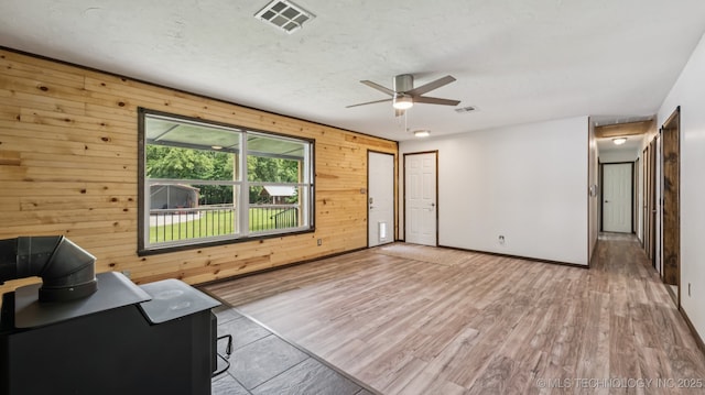 20512 E 430th Rd, Claremore, OK 74017 - unfurnished room with wood walls, ceiling fan, and wood finished floors