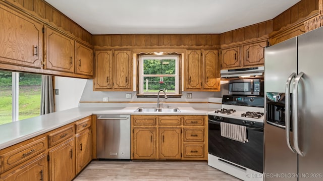 20512 E 430th Rd, Claremore, OK 74017 - kitchen with stainless steel appliances, brown cabinets, and light countertops