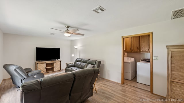 20512 E 430th Rd, Claremore, OK 74017 - living room with washing machine and dryer, ceiling fan, and light wood-type flooring