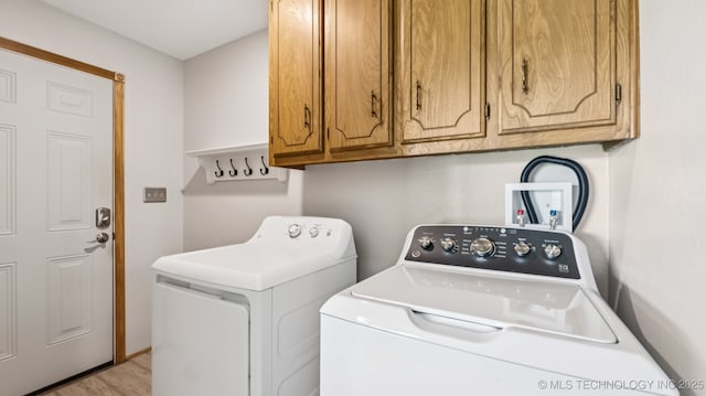 20512 E 430th Rd, Claremore, OK 74017 - laundry room with cabinet space, washer and dryer, and light wood finished floors