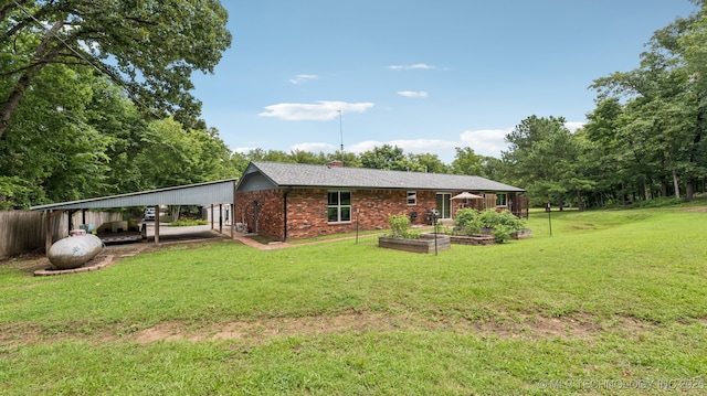 20512 E 430th Rd, Claremore, OK 74017 - rear view of property with a garden, brick siding, and a chimney