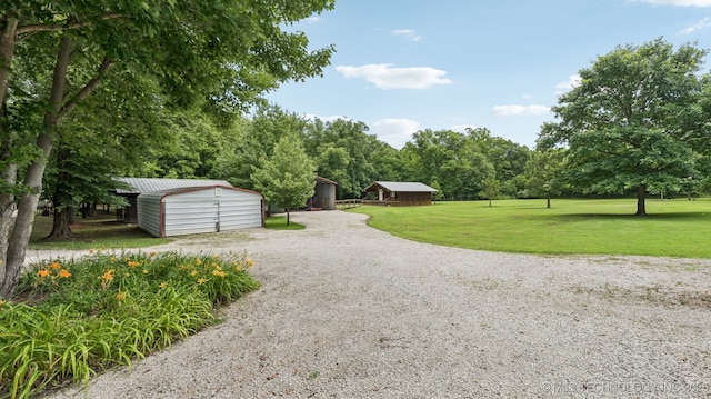 20512 E 430th Rd, Claremore, OK 74017 - view of grassy yard featuring an outdoor structure and driveway