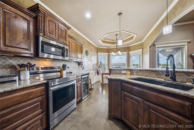 5983 E 137th St, Collinsville, OK 74021 - kitchen featuring appliances with stainless steel finishes, concrete flooring, light stone countertops, decorative backsplash, and ornamental molding