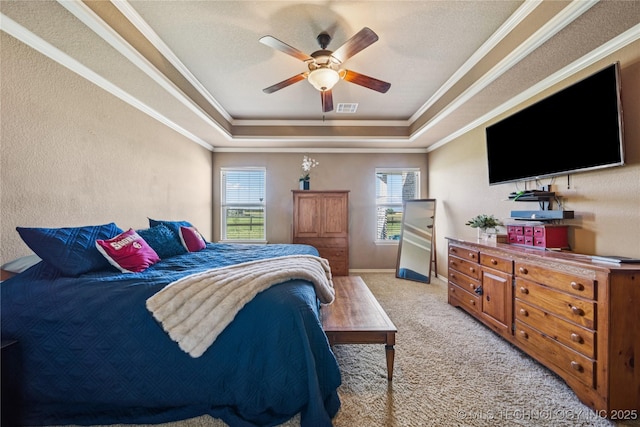 5983 E 137th St, Collinsville, OK 74021 - bedroom featuring a tray ceiling, multiple windows, ornamental molding, carpet, and ceiling fan