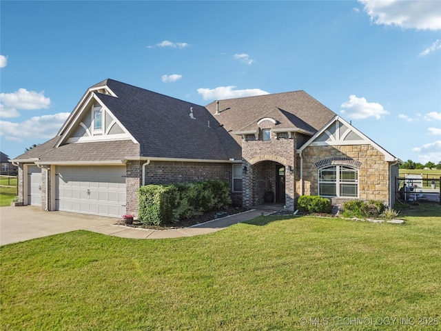 5983 E 137th St, Collinsville, OK 74021 - view of front of house with concrete driveway, roof with shingles, a front lawn, brick siding, and stone siding