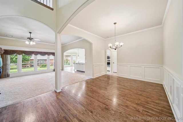 4204 N Maple Pl, Broken Arrow, OK 74012 - spare room featuring healthy amount of natural light, crown molding, a ceiling fan, wood finished floors, and a chandelier