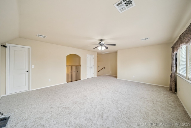 4204 N Maple Pl, Broken Arrow, OK 74012 - carpeted empty room with a ceiling fan and arched walkways