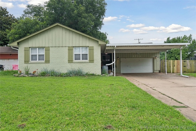 5718 E 27th St, Tulsa, OK 74114 - ranch-style home featuring a carport, a garage, brick siding, and driveway