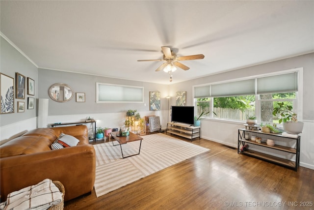 5718 E 27th St, Tulsa, OK 74114 - living room featuring a ceiling fan, wood finished floors, and ornamental molding