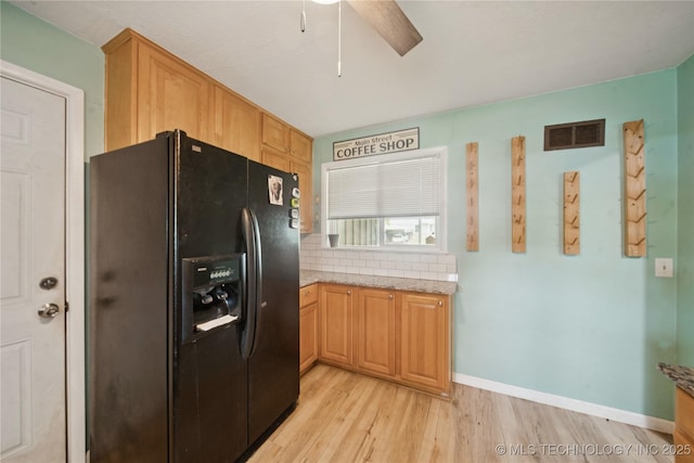 5718 E 27th St, Tulsa, OK 74114 - kitchen with black refrigerator with ice dispenser, light wood finished floors, a ceiling fan, light stone countertops, and tasteful backsplash
