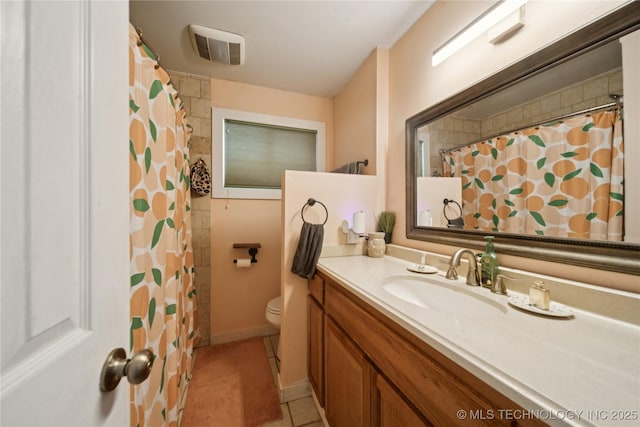 5718 E 27th St, Tulsa, OK 74114 - full bath featuring tile patterned flooring, vanity, and a shower with curtain