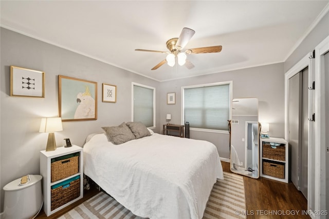 5718 E 27th St, Tulsa, OK 74114 - bedroom featuring wood finished floors, crown molding, ceiling fan, and a closet