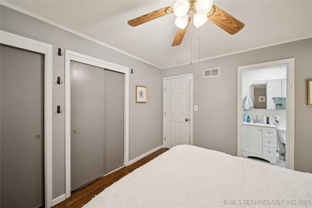 5718 E 27th St, Tulsa, OK 74114 - bedroom with dark wood-style floors, ornamental molding, and ceiling fan