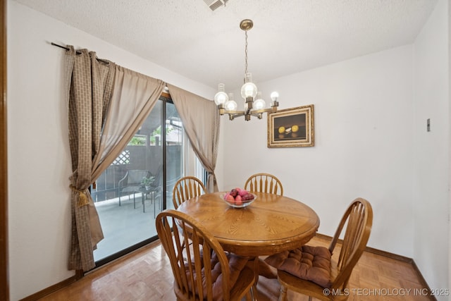 1234 S 110th E Ave Unit 59-4A, Tulsa, OK 74128 - dining room with a chandelier and a textured ceiling