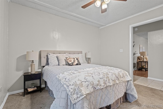 1015 NW Maxwell, Ardmore, OK 73401 - carpeted bedroom featuring a textured ceiling, ceiling fan, and tile patterned floors