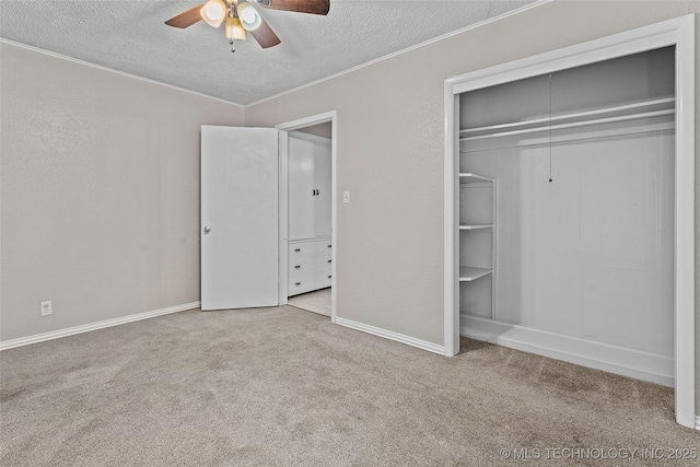 1015 NW Maxwell, Ardmore, OK 73401 - unfurnished bedroom with carpet flooring, a textured ceiling, a closet, crown molding, and a ceiling fan