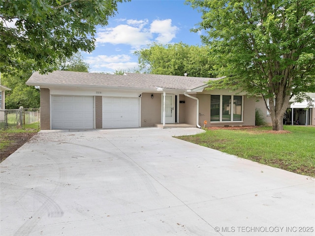 1015 NW Maxwell, Ardmore, OK 73401 - single story home with a garage, concrete driveway, and brick siding