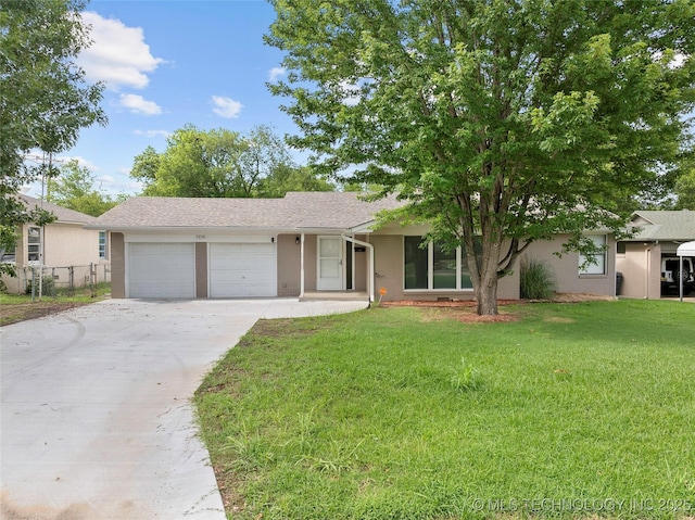 1015 NW Maxwell, Ardmore, OK 73401 - ranch-style house with a garage, concrete driveway, and stucco siding