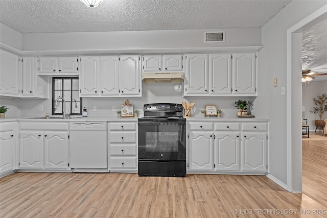 1015 NW Maxwell, Ardmore, OK 73401 - kitchen with white dishwasher, black / electric stove, under cabinet range hood, light wood-type flooring, and light countertops