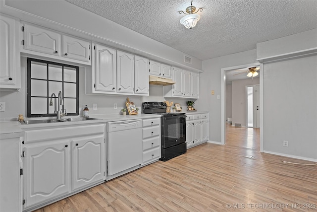 1015 NW Maxwell, Ardmore, OK 73401 - kitchen with black range with electric cooktop, white dishwasher, under cabinet range hood, a textured ceiling, and light wood-style flooring