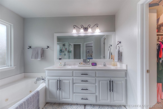 7349 E 119th Pl S, Bixby, OK 74008 - bathroom featuring plenty of natural light, double vanity, a stall shower, and a jetted tub