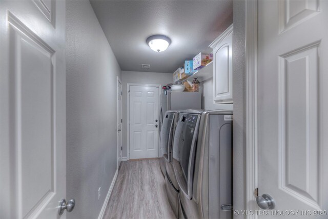 7349 E 119th Pl S, Bixby, OK 74008 - laundry room with separate washer and dryer, cabinet space, and light wood finished floors
