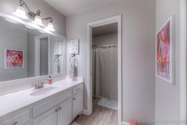 7349 E 119th Pl S, Bixby, OK 74008 - full bath with vanity, wood finished floors, and a shower with curtain
