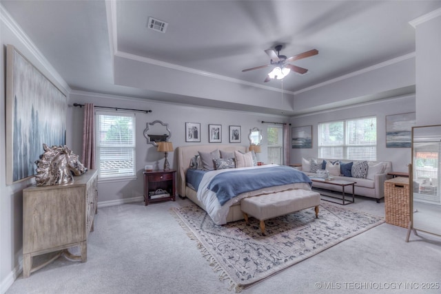 7349 E 119th Pl S, Bixby, OK 74008 - bedroom featuring a tray ceiling, carpet floors, ornamental molding, and a ceiling fan