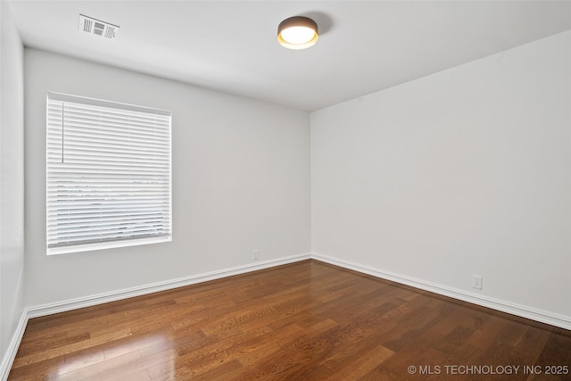 3039 W 69th Pl, Tulsa, OK 74132 - spare room featuring wood finished floors and baseboards