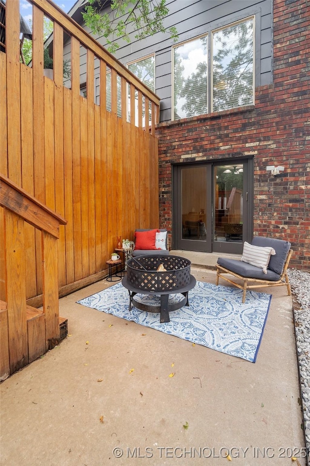 3039 W 69th Pl, Tulsa, OK 74132 - view of patio / terrace featuring a fire pit