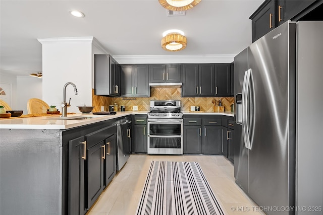 3039 W 69th Pl, Tulsa, OK 74132 - kitchen with stainless steel appliances, a peninsula, backsplash, light countertops, and crown molding