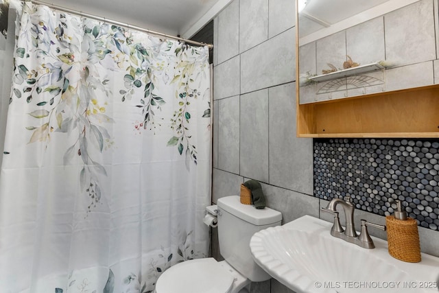 4844 S 30th Ave W, Tulsa, OK 74107 - full bathroom with tile walls, backsplash, and a shower with shower curtain