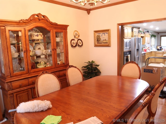 7054 E 149th St, Collinsville, OK 74021 - dining space featuring a chandelier and crown molding