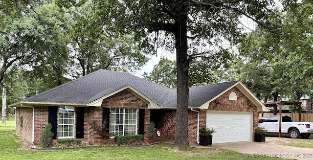 417292 E 1145th Rd, Eufaula, OK 74432 - view of front facade with a garage, roof with shingles, driveway, and brick siding