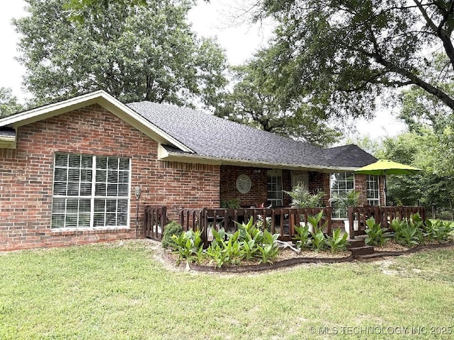 417292 E 1145th Rd, Eufaula, OK 74432 - rear view of property with a yard, brick siding, and a wooden deck
