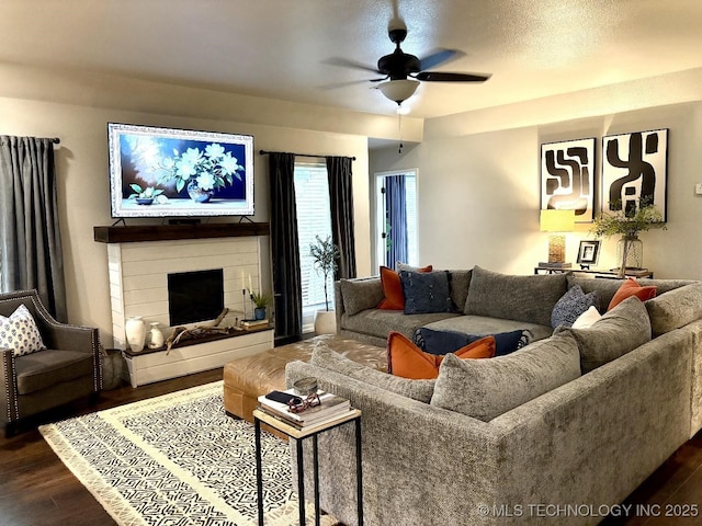 417292 E 1145th Rd, Eufaula, OK 74432 - living area featuring ceiling fan, dark wood-style floors, and a fireplace