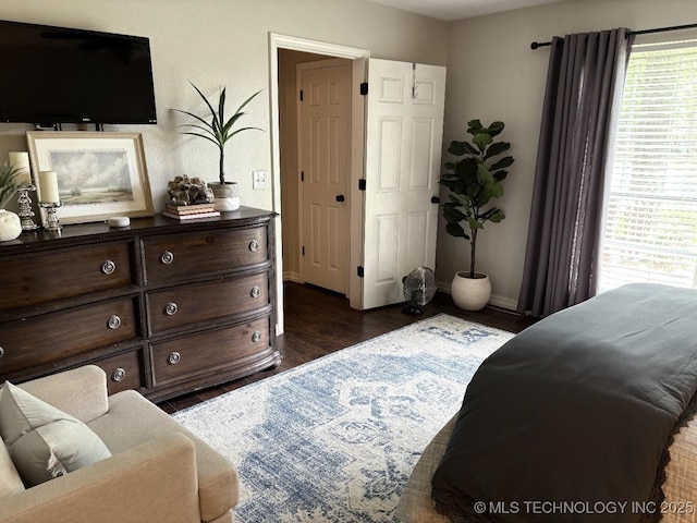 417292 E 1145th Rd, Eufaula, OK 74432 - bedroom with multiple windows and dark wood finished floors