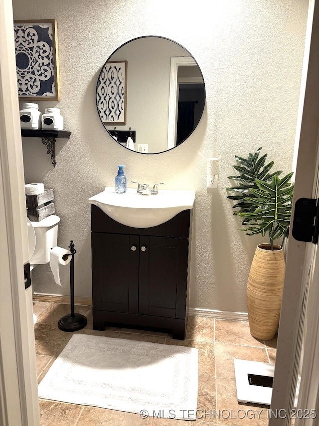 417292 E 1145th Rd, Eufaula, OK 74432 - bathroom featuring vanity and a textured wall