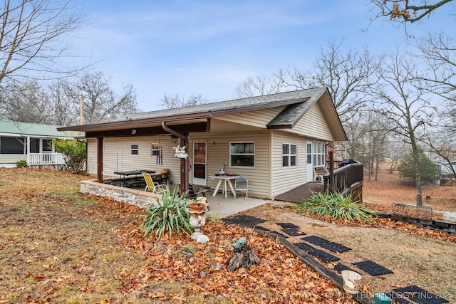 2219 Hart Cove Dr, Grove, OK 74344 - back of house featuring roof with shingles, a patio area, and a deck