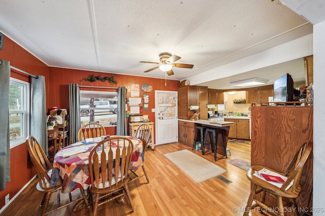 2219 Hart Cove Dr, Grove, OK 74344 - dining area featuring light wood-type flooring, ceiling fan, and a textured ceiling