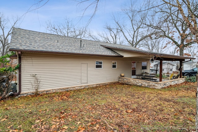 2219 Hart Cove Dr, Grove, OK 74344 - back of house featuring a shingled roof and a patio