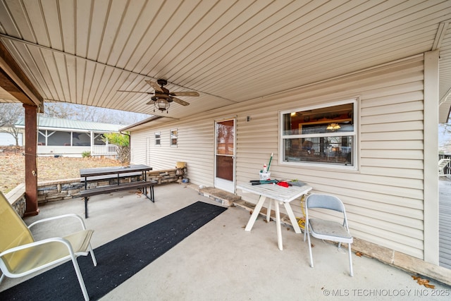 2219 Hart Cove Dr, Grove, OK 74344 - view of patio with ceiling fan and a sunroom