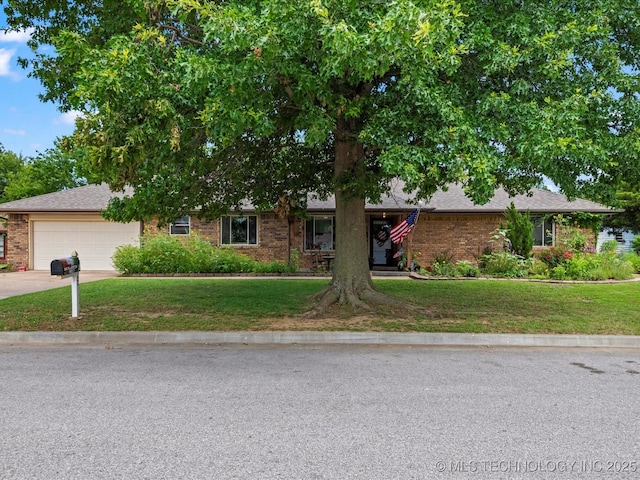 105 Quail Creek Ln, Skiatook, OK 74070 - view of front of home featuring a front yard, a garage, driveway, brick siding, and roof with shingles