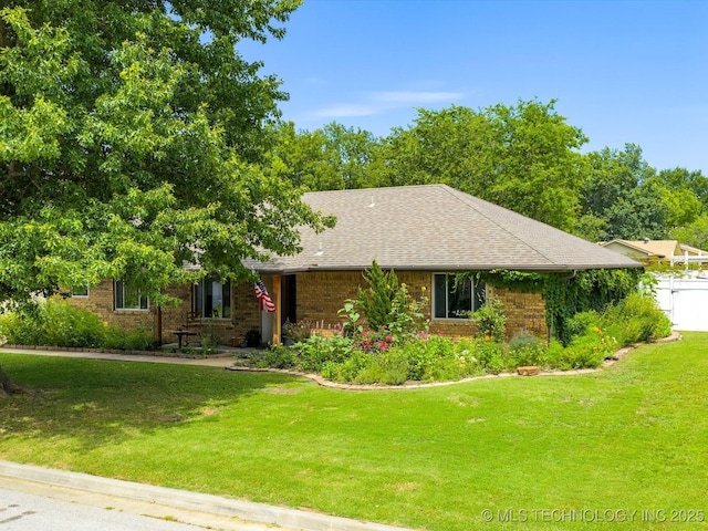 105 Quail Creek Ln, Skiatook, OK 74070 - view of front facade featuring brick siding, a front lawn, and roof with shingles